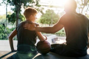 Parent talking to athlete and being encouraging