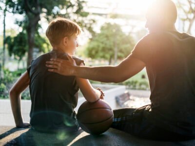 Parent talking to athlete and being encouraging