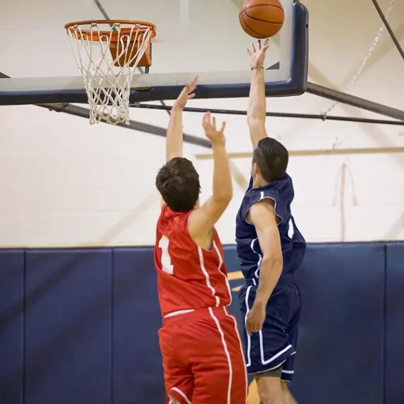 Young Athlete scoring a layup during a school game