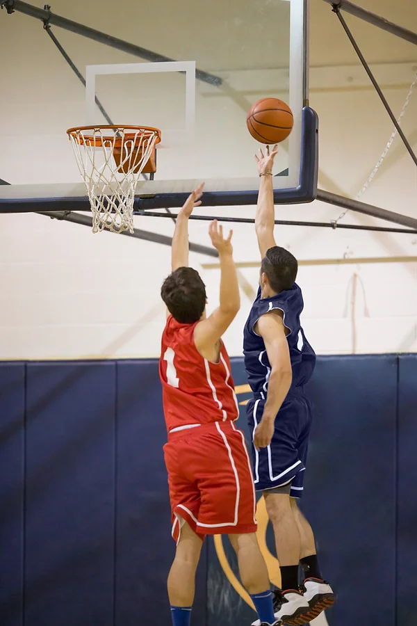 Young Athlete scoring a layup during a school game